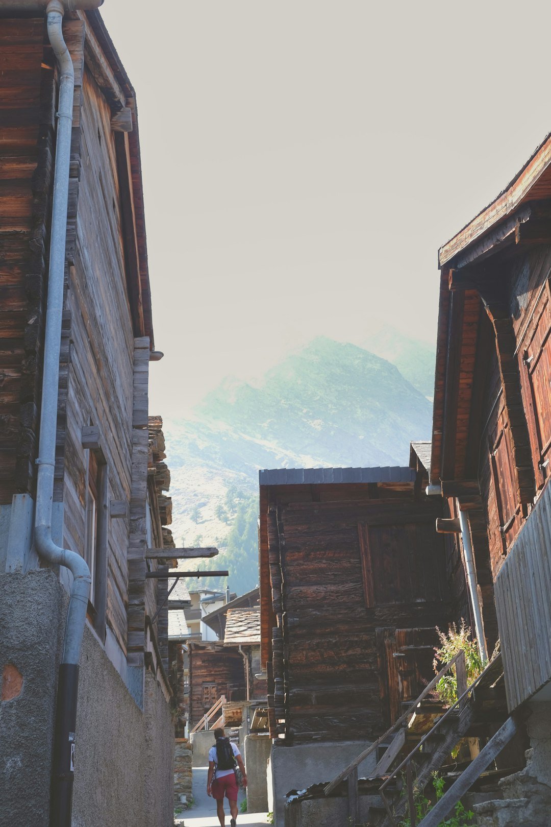 a-person-walking-down-a-narrow-alley-way-bclmxkbvonk